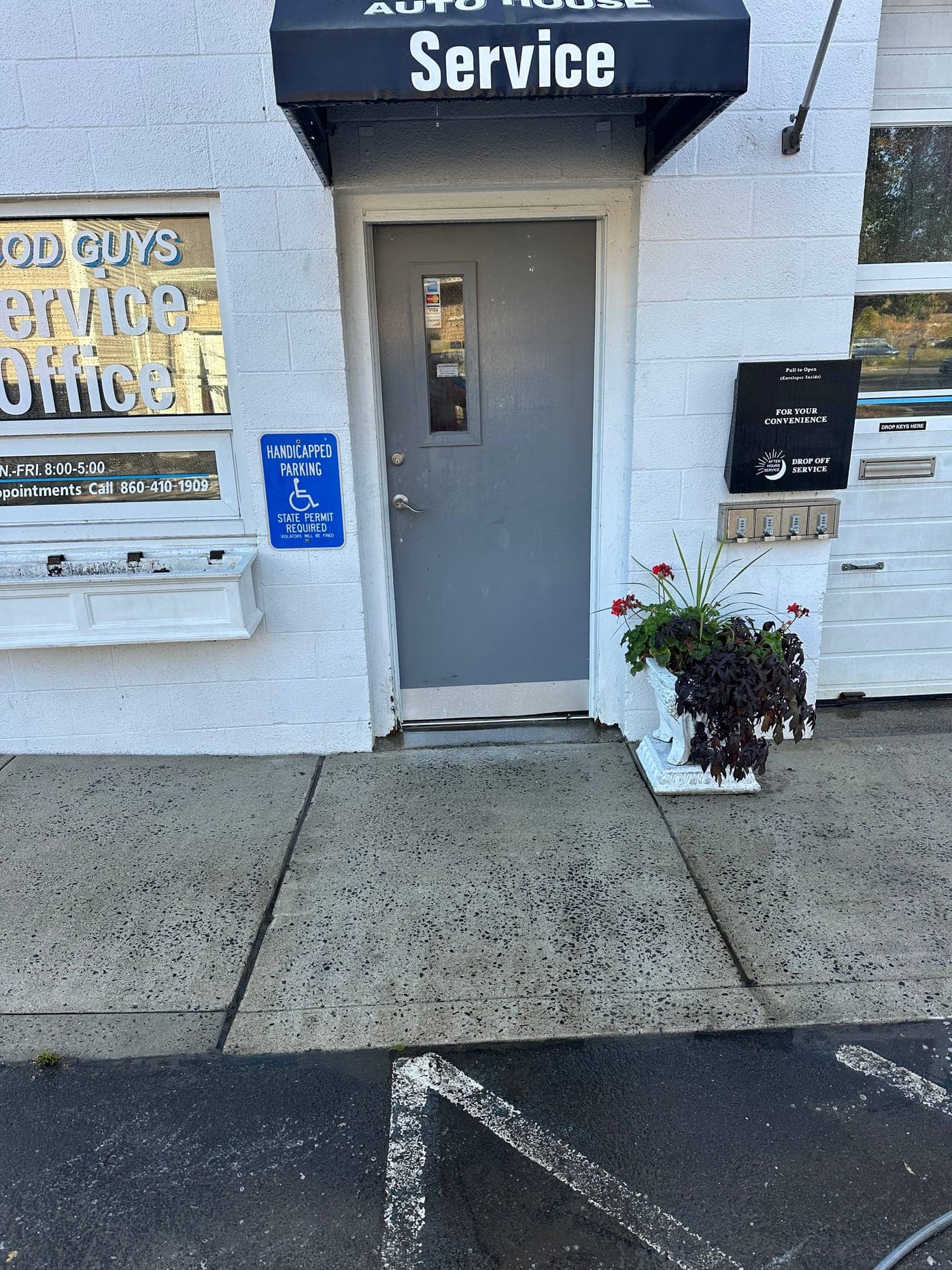 Cleaned commercial storefront exterior and concrete sidewalk