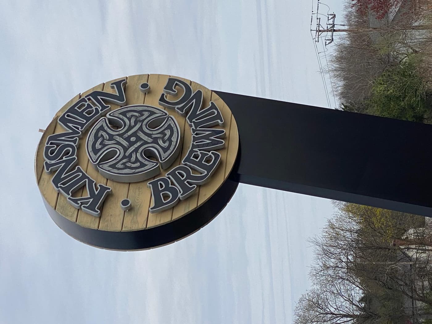 Kinsmen Brewing barrel-style Celtic sign at brewery serviced by Pals Power Washing