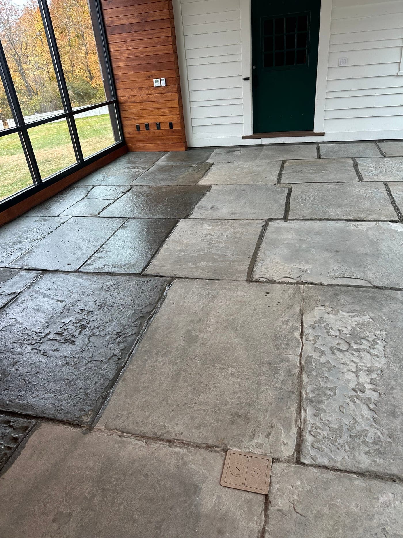 Cleaned flagstone patio inside covered porch at the same estate